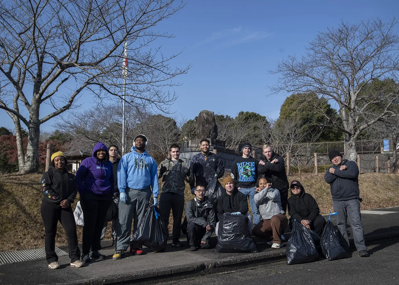 Volunteers gathered on a trail after a community clean-up